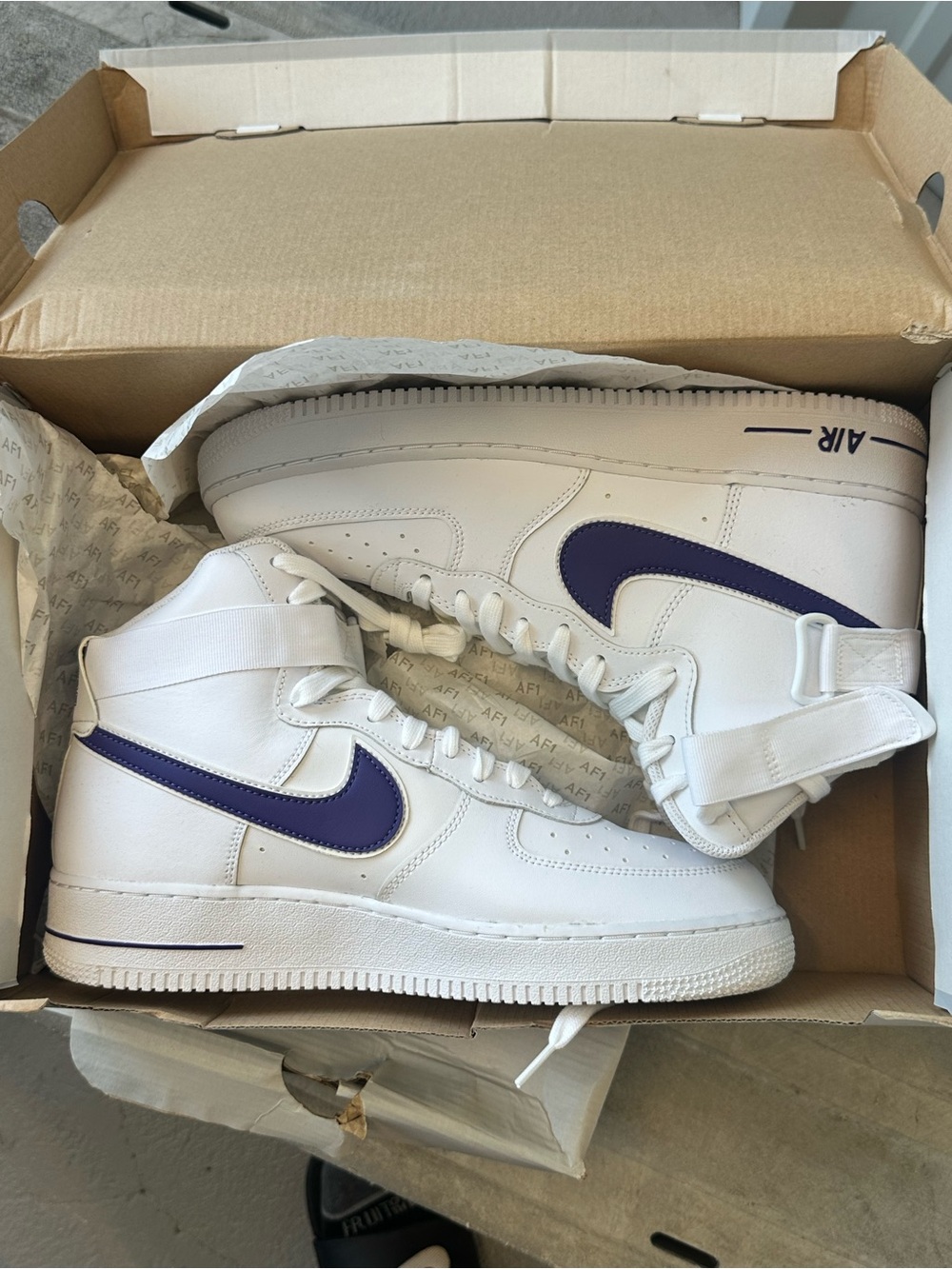 Nike White High-Top Sneakers with Purple Swoosh
